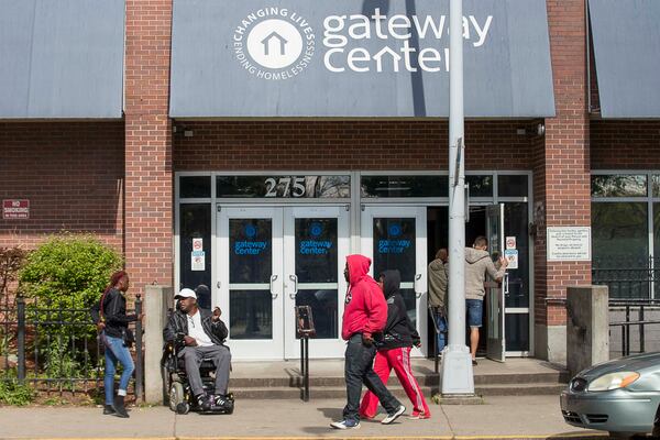 04/01/2020 - Atlanta, Georgia  - People gather outside of the Gateway Center in Atlanta, Wednesday, April 1, 2020. The Gateway Center is a homeless service center. (ALYSSA POINTER / ALYSSA.POINTER@AJC.COM)