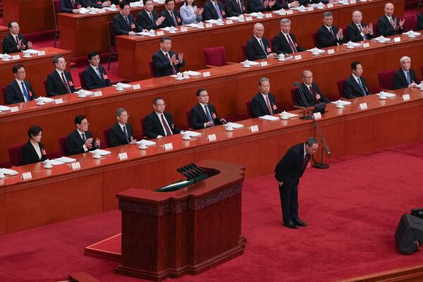 Chinese Premier Li Qiang bows before he delivers his speech during the opening session of the National People's Congress (NPC) at the Great Hall of the People in Beijing, China, Wednesday, March 5, 2025. (AP Photo/Andy Wong)