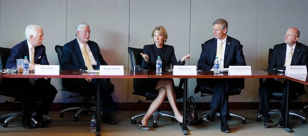  Dean Alford (from left), State Board of Regents, Wayne Johnson, Department of Education, Betsy DeVos, U.S. Education Department Secretary , G. P. "Bud" Peterson, Georgia Tech President, and Dene Sheheane, Georgia Tech Vice President, take part in the meeting. DeVos made a stop at Georgia Tech on Wednesday where she meet with students to learn about Tech's efforts to rethink college education and to promote a new mobile FAFSA app that's touted to streamline the financial aid application process. Johnson is making a bid for the U.S. Senate. 