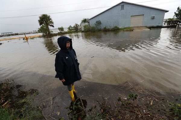 September 4, 2019 St. Mary's: Cheryl Conners looks over flood waters surrounding Langs Marina near her home during Hurricane Dorian on Wednesday, Sept. 4, 2019, at St. Mary's.   Curtis Compton/ccompton@ajc.com