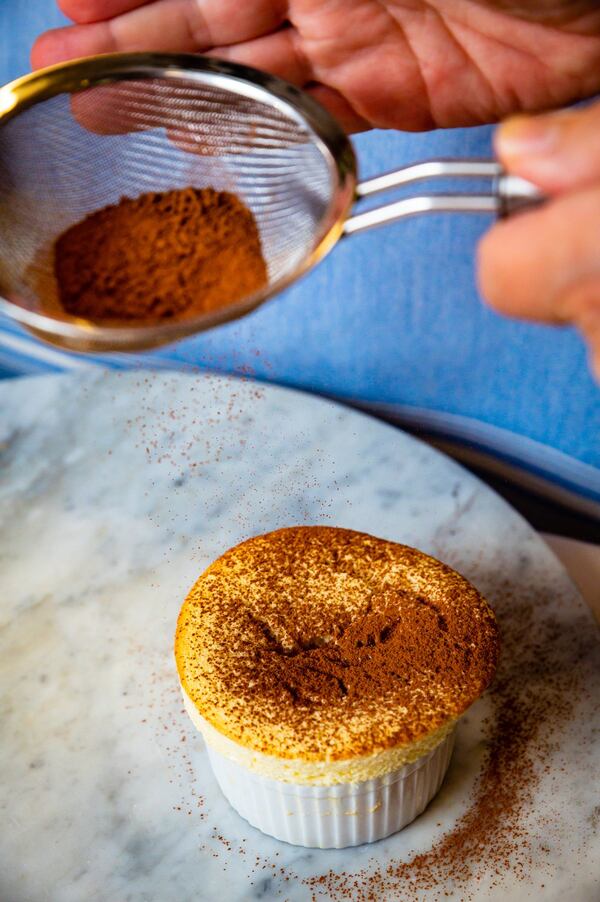 You can sprinkle cocoa or confectioners’ sugar on the Souffle Grand Marnier. CONTRIBUTED BY HENRI HOLLIS