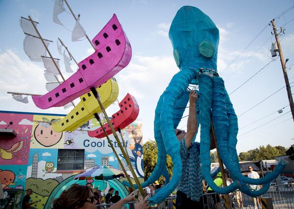 Jeffry Loy puts the last minute touches on his Lantern before the start of the Atlanta BeltLine Lantern Parade Saturday, September 22, 2018. STEVE SCHAEFER/SPECIAL TO THE AJC