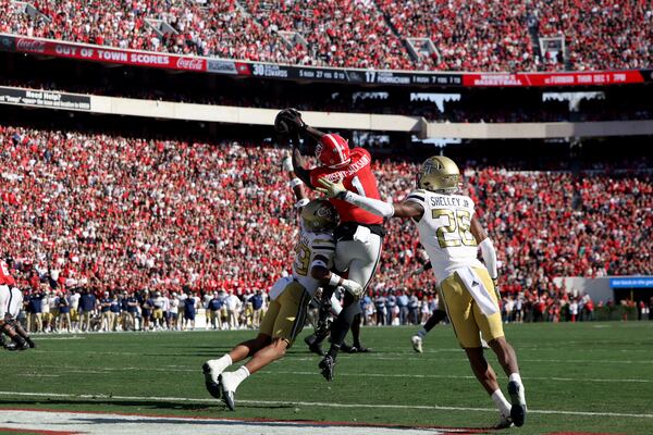 Georgia Bulldogs wide receiver Marcus Rosemy-Jacksaint (1) catches a five-yard touchdown in the second quarter against the Georgia Tech Yellow Jackets in an NCAA football game at Sanford Stadium, on Saturday, Nov. 26, 2022, in Athens, Georgia. (Jason Getz/The Atlanta Journal-Constitution)