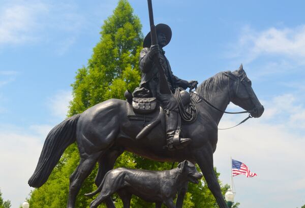 An equestrian statue honoring Deputy U.S. Marshal Bass Reeves stands in Fort Smith, Ark. A statement about the artwork on the Fort Smith website says that Reeves "brought in more outlaws from eastern Oklahoma and western Arkansas than anyone else. He was able to memorize the warrants for every suspect he was to arrest and bring to trial." (Courtesy of U.S. Marshals Service)