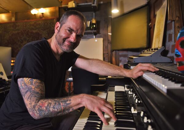 Brandon Bush, brother of Sugarland's Kristian, poses for a portrait inside his Decatur studio he shares with his brother. Photo:  Ryon Horne/RHORNE@AJC.COM