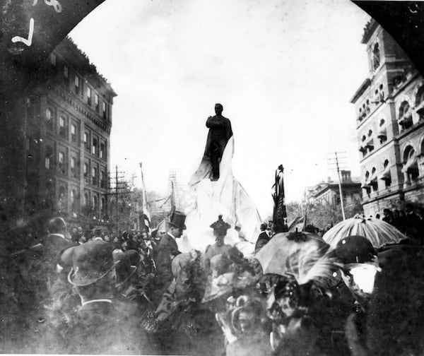 Photo taken on Oct. 21, 1891, shows the unveiling of the Henry Grady statue at Marietta and Forsyth streets. A crowd of 25,000 attended, even lining the tops of buildings.  (credit: Atlanta Historical Society)