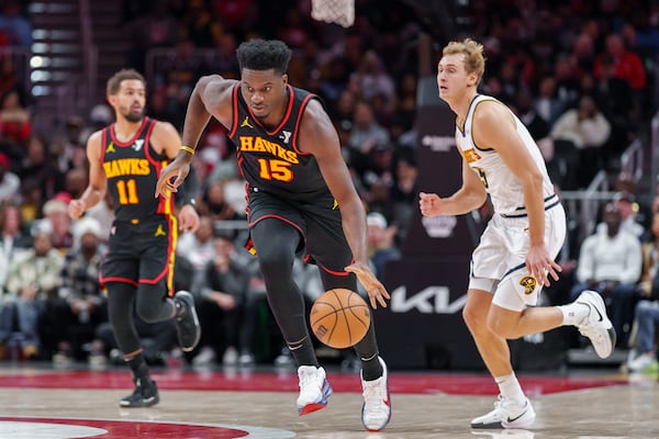 Atlanta Hawks center Clint Capela (15) dribbles the ball down court after retrieving a loose ball during the first half of an NBA basketball game against the Denver Nuggets on Sunday, Dec. 8, 2024, in Atlanta, at State Farm Arena. (Atlanta Journal-Constitution/Jason Allen)