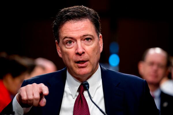 FILE - In this June 8, 2017 file photo, former FBI director James Comey speaks during a Senate Intelligence Committee hearing on Capitol Hill, in Washington. Comey is blasting President Donald Trump as âunethical and untethered to truth,â and says Trumpâs leadership of the country is âego driven and about personal loyalty.â Comeyâs comments come in a new book in which he casts Trump as a mafia boss-like figure who sought to blur the line between law enforcement and politics. (AP Photo/Andrew Harnik, File)