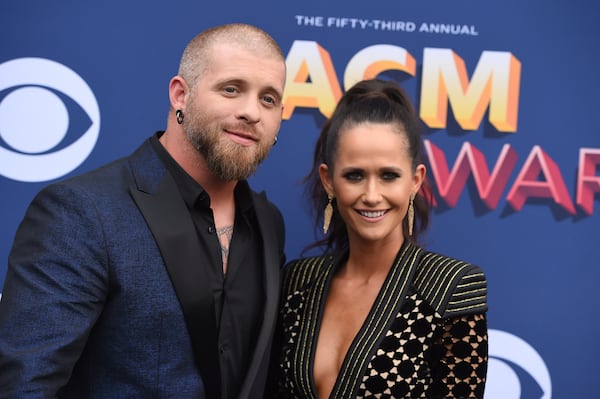 Brantley Gilbert, left, and Amber Cochran arrive at the 53rd annual Academy of Country Music Awards at the MGM Grand Garden Arena on Sunday, April 15, 2018, in Las Vegas. (Photo by Jordan Strauss/Invision/AP)