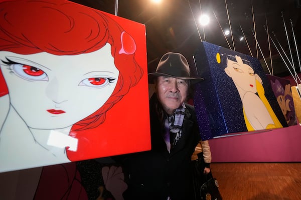 Artist Yoshitaka Amano poses during the press preview of the exhibition "Amano Corpus Animae", celebrating his 50-year-long career, at the Fabbrica del Vapore, in Milan, Italy, Tuesday, Nov. 12, 2024. (AP Photo/Luca Bruno)