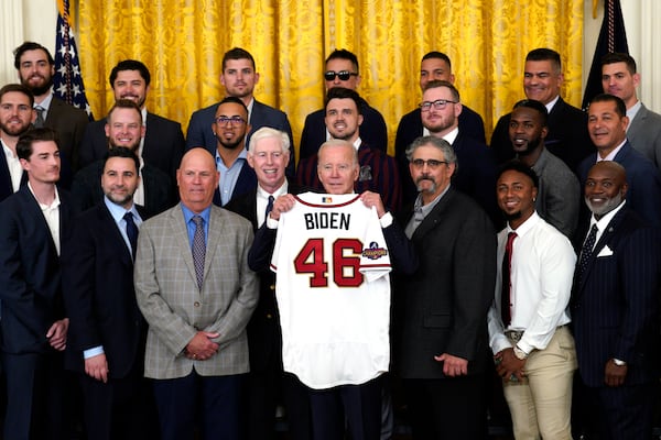 U.S. President Joe Biden is presented a jersey as he welcomes the Atlanta Braves, winners of the 2021 Baseball World Series, in the East Room at the White House in Washington, D.C., on Monday, Sept. 26, 2022. (Yuri Gripas/Abaca Press/TNS)