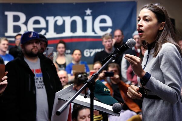 Rep. Alexandria Ocasio-Cortez  speaks as a surrogate of Democratic presidential candidate Bernie Sanders on Saturday in Iowa.