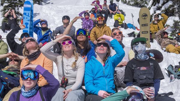 Competitors and friends watch from below in a Freeride World Tour qualifier competition held on Silver King at Crystal Mountain, March 17, 2016.  Dozens of snowboarders and skiers reached the finals in the multi-day event. (Peter Haley/The News Tribune/TNS