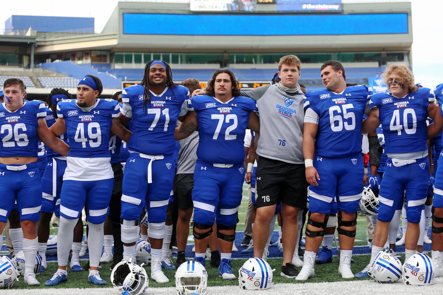 Members of the Georgia State football team gather after the 30-24 win over Georgia Southern to sing “Georgia On My Mind” on Saturday, November 28, 2020. CHRISTINA MATACOTTA FOR THE ATLANTA JOURNAL-CONSTITUTION