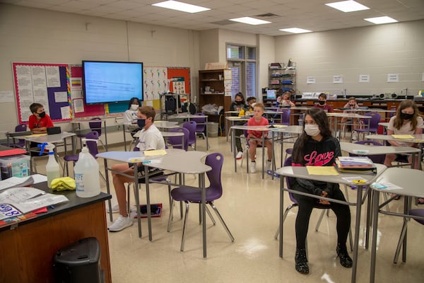 08/20/2020 - Cartersville, Georgia - Cartersville Middle School students sit socially distant in Omar NuezÕs Spanish class at Cartersville Middle School in Cartersville, Thursday, August 20, 2020.  (ALYSSA POINTER / ALYSSA.POINTER@AJC.COM)