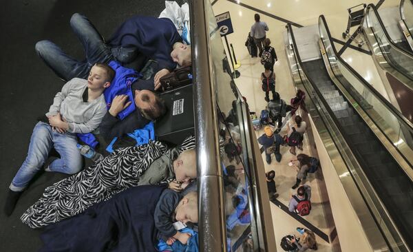 Stranded passengers at Hartsfield-Jackson last week. JOHN SPINK /JSPINK@AJC.COM