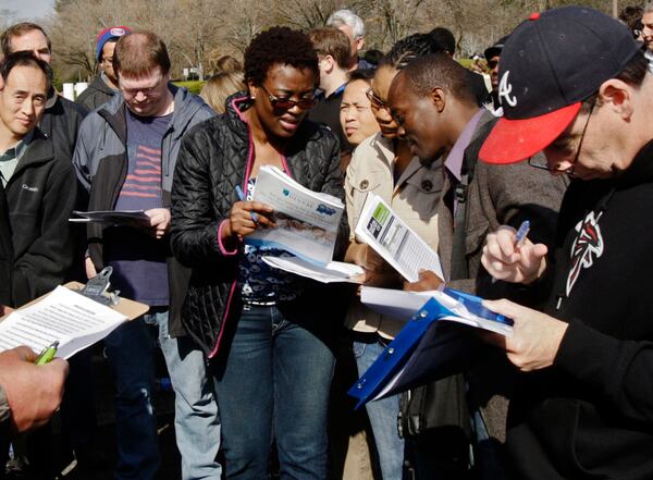 Buyers gather in 2013 for the monthly foreclosure auction at the Gwinnett Courthouse in Lawrenceville. BOB ANDRES / BANDRES@AJC.COM