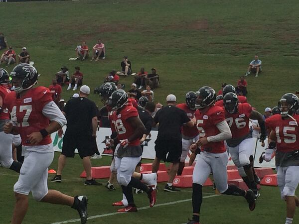 The Falcons hustling between drills on Tuesday, (By D. Orlando Ledbetter/DLedbetter@ajc.com)