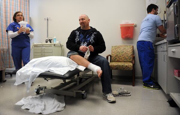  Then Det. Pat Apoian during an appointment at Northside Hospital-Forsyth on Feb. 21, 2013, nearly two years after suffering life-threatening injuries on the job. AJC photo: Bita Honarvar