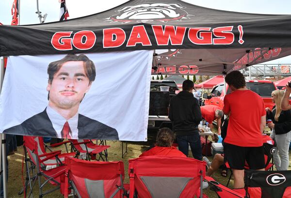 Football fans enjoy tailgating at The Home Depot Backyard prior to the Southeastern Conference championship NCAA college football game between Georgia and Alabama at Mercedes-Benz Stadium in Atlanta on Saturday, December 4, 2021. (Hyosub Shin / Hyosub.Shin@ajc.com)