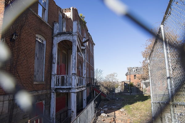 Gaines Hall, itself built in 1869, sits burned and gutted across from Fountain Hall on the campus of Morris Brown College. Another important building, Furber Cottage, built in 1899, burned down in September.  (ALYSSA POINTER/ALYSSA.POINTER@AJC.COM)