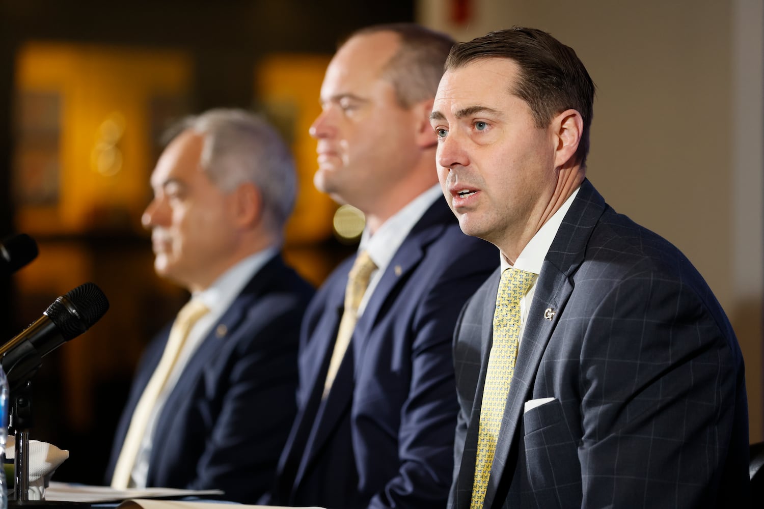 Georgia Tech athletic director J Batt (right) addresses the media introducing the new football head coach Brent Key during a news conference on Monday, Dec. 5, 2022.
 Miguel Martinez / miguel.martinezjimenez@ajc.com