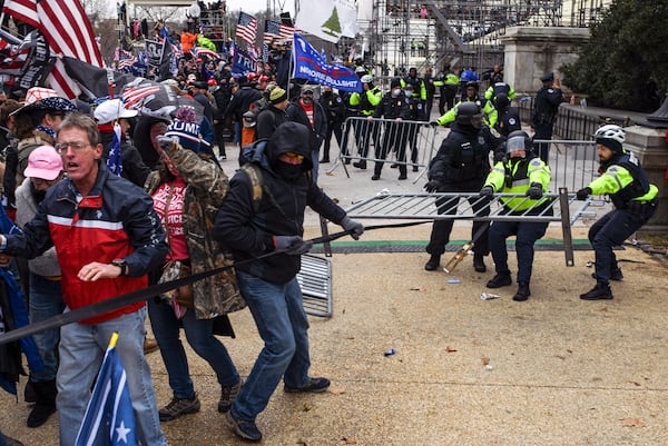 U.S. Rep. Andrew Clyde, R-Athens, objected during a House Government Oversight and Reform Committee hearing to calling the Jan. 6 riot at the Capitol and "insurrection." “To call it an insurrection, in my opinion, is a bold-faced lie,” Clyde said. “Watching the TV footage of those who entered the Capitol and walked through Statuary Hall showed people in an orderly fashion staying between the stanchions and ropes taking videos and pictures. You know, if you didn’t know the TV footage was a video from Jan. 6, you’d actually think it was a normal tourist visit.” (Kenny Holston/The New York Times)