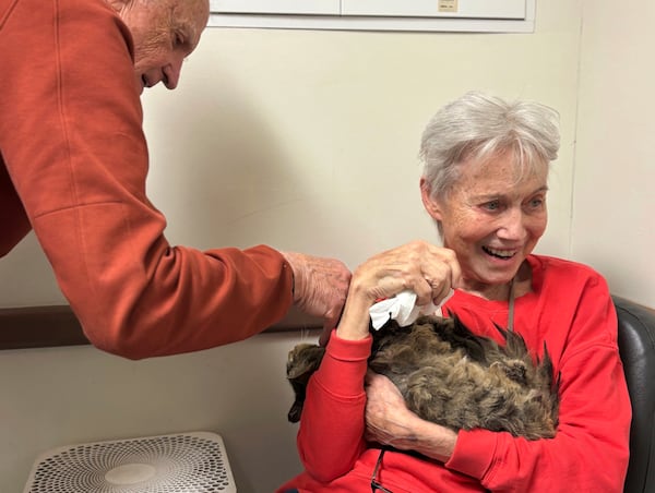 In this image provided by Carolyn Kiefer her mother, Katherine Kiefer, 82, is reunited with her cat Aggie at VCA Chatoak Animal Hospital after the Palisades Fire destroyed her home and the cat was missing, Saturday, March 8, 2025, in Los Angeles. (Carolyn Kiefer via AP)