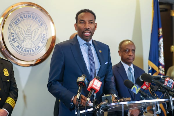 Atlanta Mayor Andre Dickens speaks to the media next to Dekalb County CEO Michael Thurmond, right, during a press conference about the planned Atlanta Public Safety Training Center at Atlanta City Hall, Tuesday, January 31, 2023, in Atlanta. Jason Getz / Jason.Getz@ajc.com)
