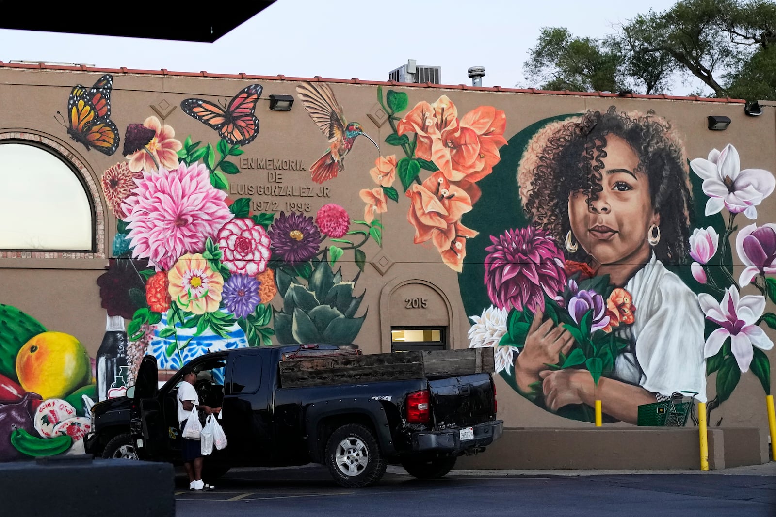 A mural is seen outside of a grocery store in Waukegan, Ill., Friday, Sept. 20, 2024. (AP Photo/Nam Y. Huh)