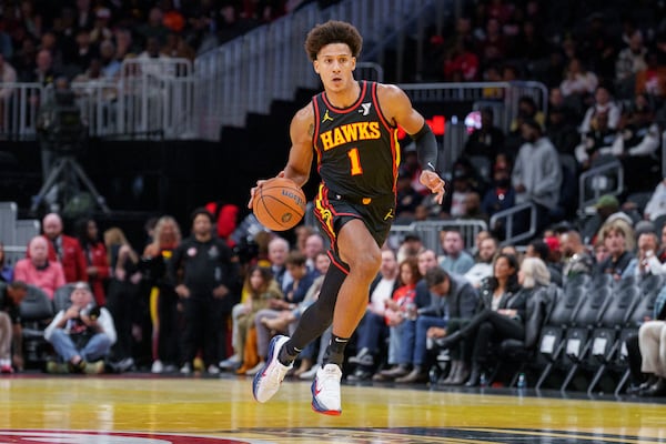 Atlanta Hawks forward Jalen Johnson (1) dribbles the ball down court during the first half of an Emirates NBA Cup basketball game against the Washington Wizards, Friday, Nov. 15, 2024, in Atlanta. (AP Photo/Jason Allen)