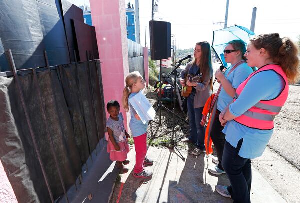 Children of abortion opponents, sing outside Jackson Women's Health Organization clinic in Jackson, Miss., Wednesday, April 10, 2019. The singing is an effort to get a pro-life message to clinic patients, since the clinic is the only medical facility that performs abortions in the state. The state legislature recently passed a law that would ban most abortions after a fetal heartbeat is detected, meaning as early as six weeks. (AP Photo/Rogelio V. Solis)