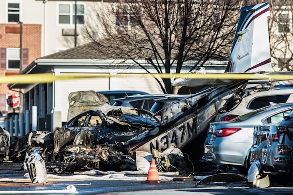 Debris is seen after a plane crashed in a parking lot of a retirement community Sunday, March 9, 2025, in Manheim Township, Pa. (Zach Gleiter/The Patriot-News via AP)