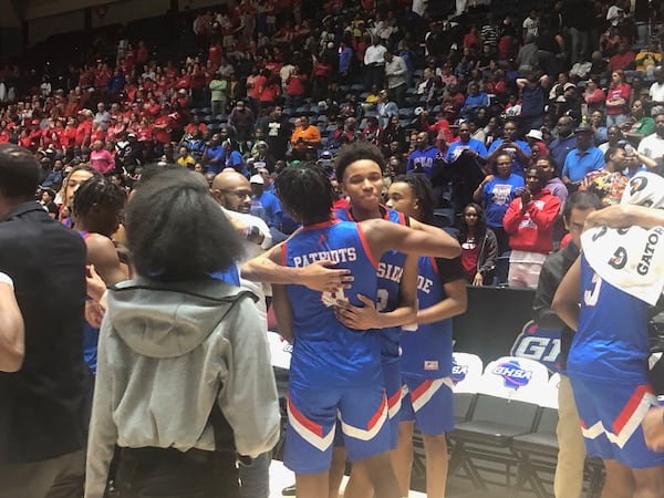 Westside-Augusta players celebrate after their 64-29 win over Toombs County, March 7, 2024, at the Macon Coliseum. It was Westside's third straight state championship.