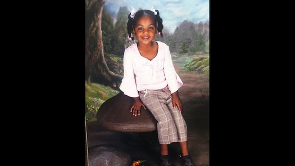 Ten-year-old Emani Moss weighed just 32 pounds when her charred body was discovered in a trash can on Nov. 2, 2013, a Gwinnett County detective testified at a probable cause hearing for her father, Eman Moss and stepmother Tiffany Moss.