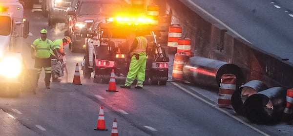 The tractor-trailer spilled steel pipes onto the westbound lanes of I-285 in a busy construction area, causing morning delays on the outer loop and Ga. 400.