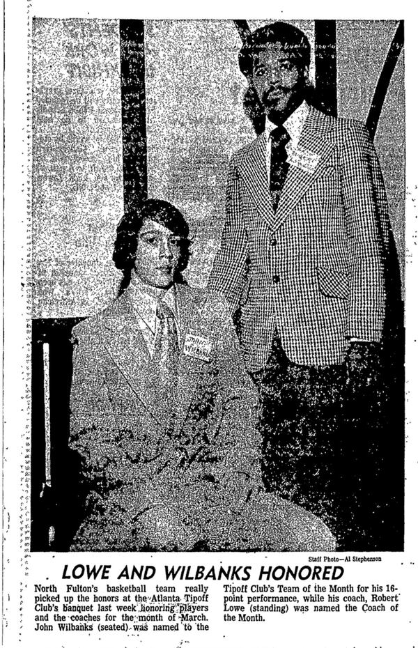 Robert Lowe became the first Black basketball coach at the mostly white North Fulton High School in the early 1970s. He was honored as Coach of the Month in 1974, as shown in this March 13 clip from the Atlanta Journal. John Wilbanks (seated) was one of Lowe's players, and was honored at the same event. (AJC archives)