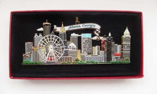 This image is from an eBay sale of a brass ornament of the Atlanta skyline, which features the SkyView Ferris wheel prominently.