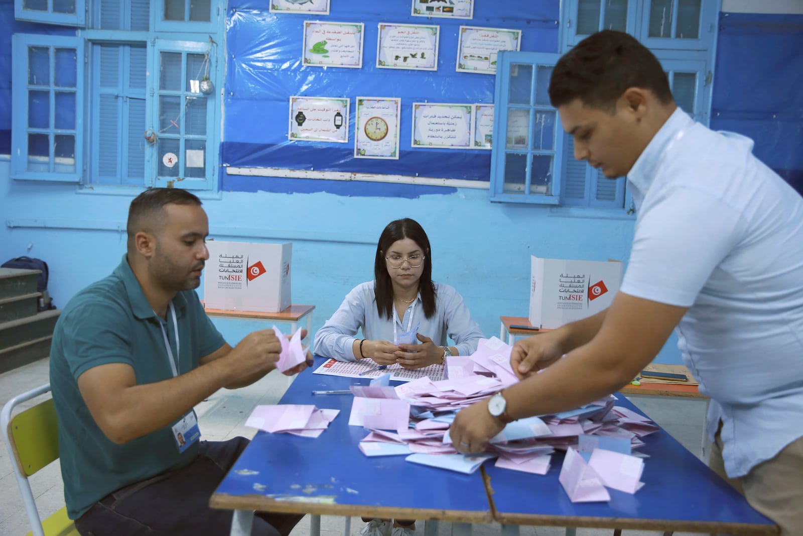 Election officials count votes after the presidential elections in the capital Tunis, Tunisia, Sunday, Oct. 6, 2024. (AP Photo/Anis Mili)