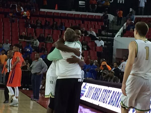  Buford coach Eddie Martin and forward Marcus Watson celebrate title.