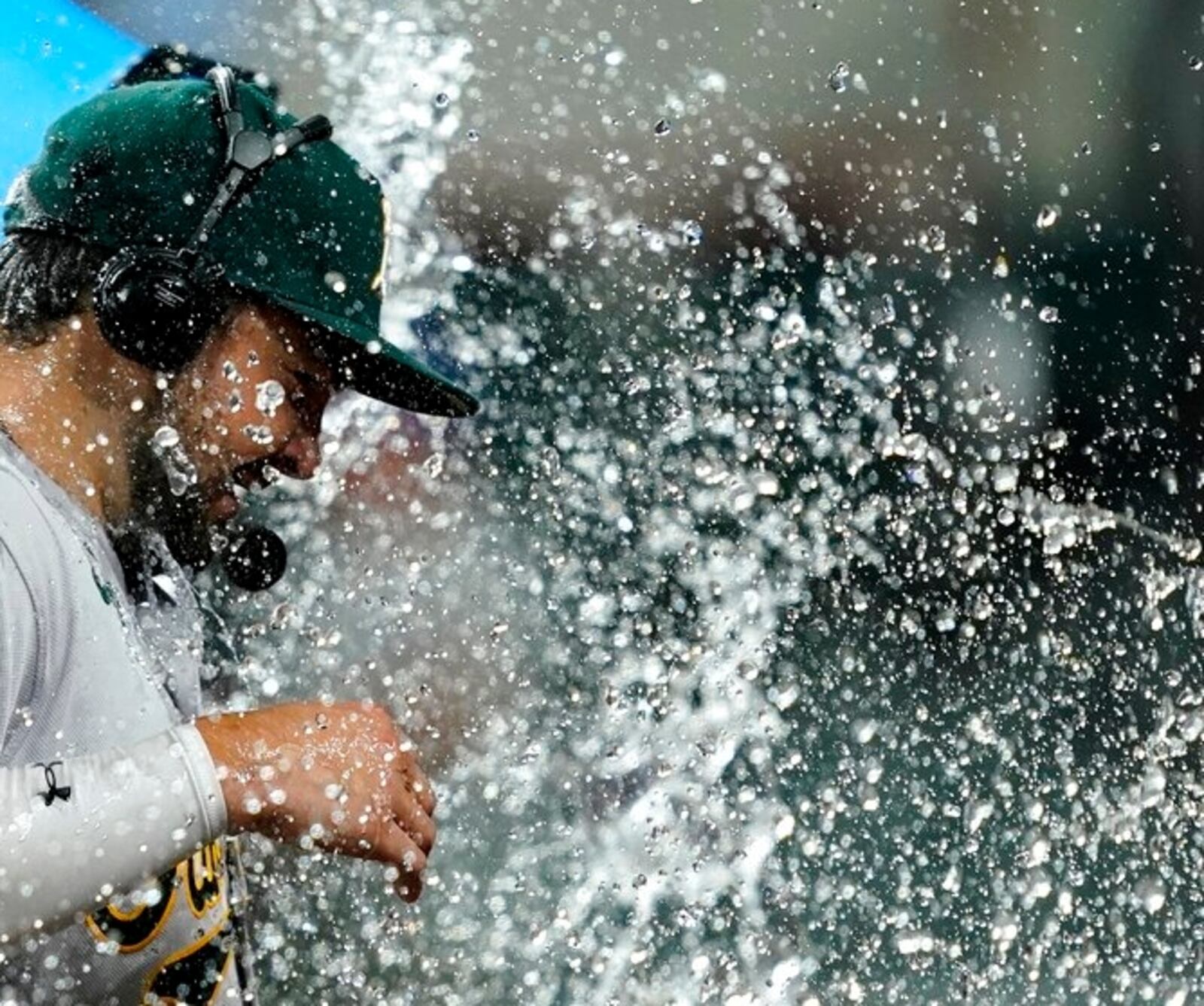 Oakland's Shea Langeliers is doused by Tony Kemp, not seen, as he gives a broadcast interview after the team's 5-1 win against the Rangers on Tuesday night in Arlington, Texas. (AP Photo/Tony Gutierrez)