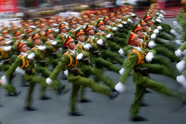 Military personnel take part in a parade celebrating the 40th anniversary of the end of the Vietnam War which is also remembered as the "Fall of Saigon," in Ho Chi Minh City, Vietnam, Thursday, April 30, 2015. The city once known as Saigon was festooned in red banners on Thursday that read "Long Live the Glorious Party of Vietnam," 40 years after communist forces seized control of the country and America walked away from a divisive and bloody war that remains a painful sore.