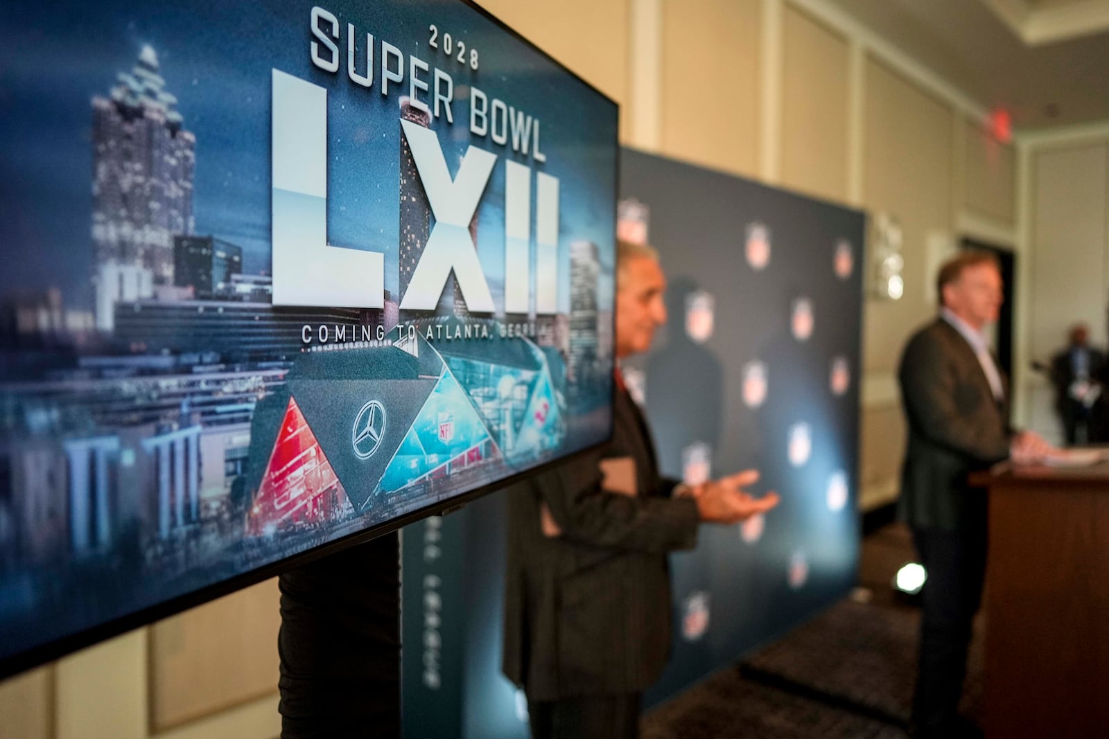 NFL commissioner Roger Goodell (right) speaks during a news conference on Tuesday in Atlanta. 