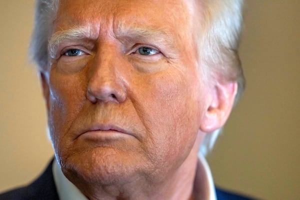 President Donald Trump speaks to reporters aboard Air Force One as he travels from Las Vegas to Miami on Saturday, Jan. 25, 2025. (AP Photo/Mark Schiefelbein)