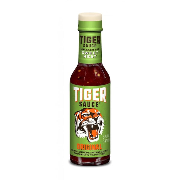 Cayenne-based Original Tiger Sauce is flavored with vinegar, crushed red peppers, tamarind, oregano, cumin and garlic. You can splash it on meats, seafood, dips and sandwiches.