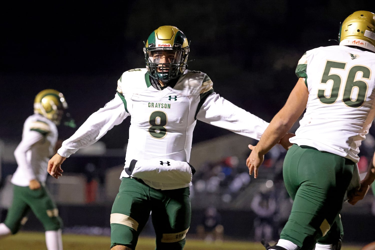 Dec. 18, 2020 - Norcross, Ga: Grayson quarterback Jake Garcia (8) celebrates his touchdown pass with Walker Williams (56) during the first half against Norcross in the Class AAAAAAA semi-final game at Norcross high school Friday, December 18, 2020 in Suwanee, Ga.. JASON GETZ FOR THE ATLANTA JOURNAL-CONSTITUTION