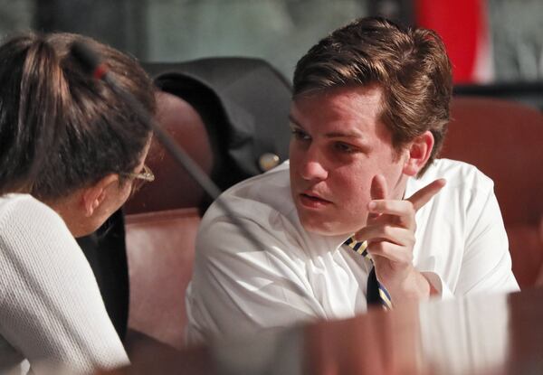 City Councilman Matt Westmoreland confers with Councilwoman Jennifer Ide during a recent committee work session. Westmoreland is pushing a sweeping new anti-smoking bill. BOB ANDRES /BANDRES@AJC.COM