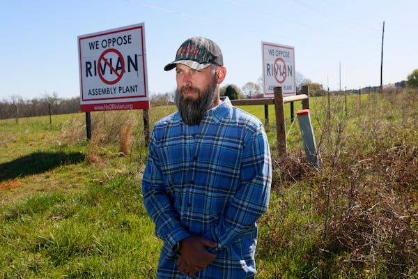 Morgan County Commissioner Blake McCormack poses for a photograph across from one of the roads leading to the Rivian construction manufacturing plant. Rivian announced its plans to halt the Georgia plant, which the newly elected official opposed when campaigning for the seat.
(Miguel Martinez /miguel.martinezjimenez@ajc.com)