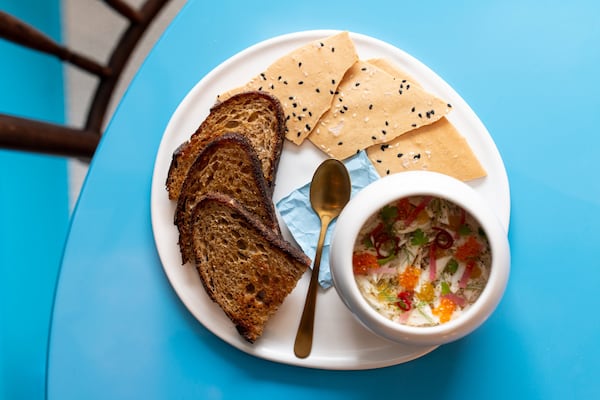 Blue Crab Beu Monde with chilled crab, roasted celeriac, lemon, fresh herbs, crusty bread, and benne crackers. Photo credit- Mia Yakel.