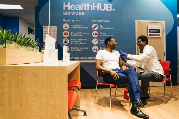 In this photo from October, Atlanta City Mayor Andre Dickens gets vaccinated at CVS for the flu. (Olivia Bowdoin for the AJC).